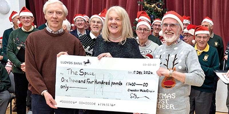 Cheddar Male Choir Presents a cheque for £1,400 to ‘The Space Charity’